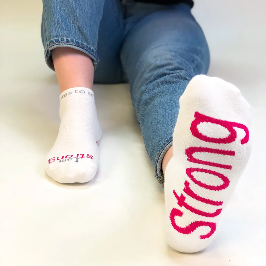 I am strong™ white low-cut socks with bold pink words